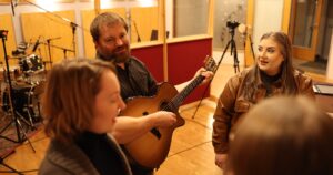 The Mountains Surround musicians practicing Psalm 127.
