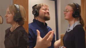 Stephen Vesolich, Lexa Jael, and Stephanie Wilsey singing together during the Psalm 128 recording session.